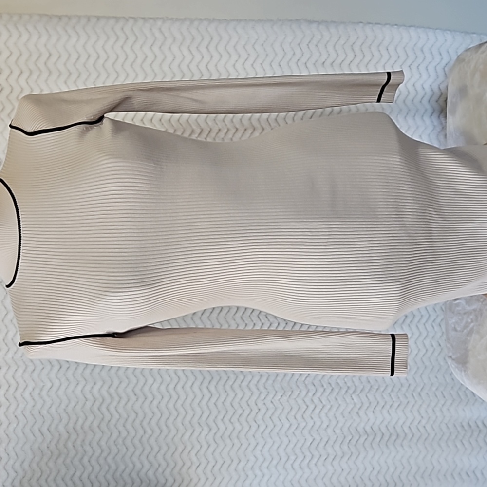 Misguided beige mini sweater dress.